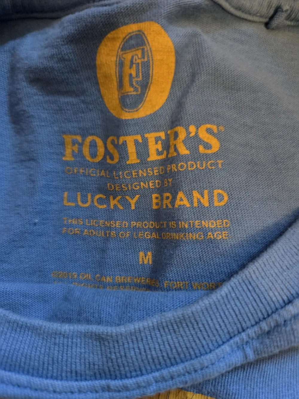 Lucky Brand Blue Foster's Logo Tee with Red & Gold Detail